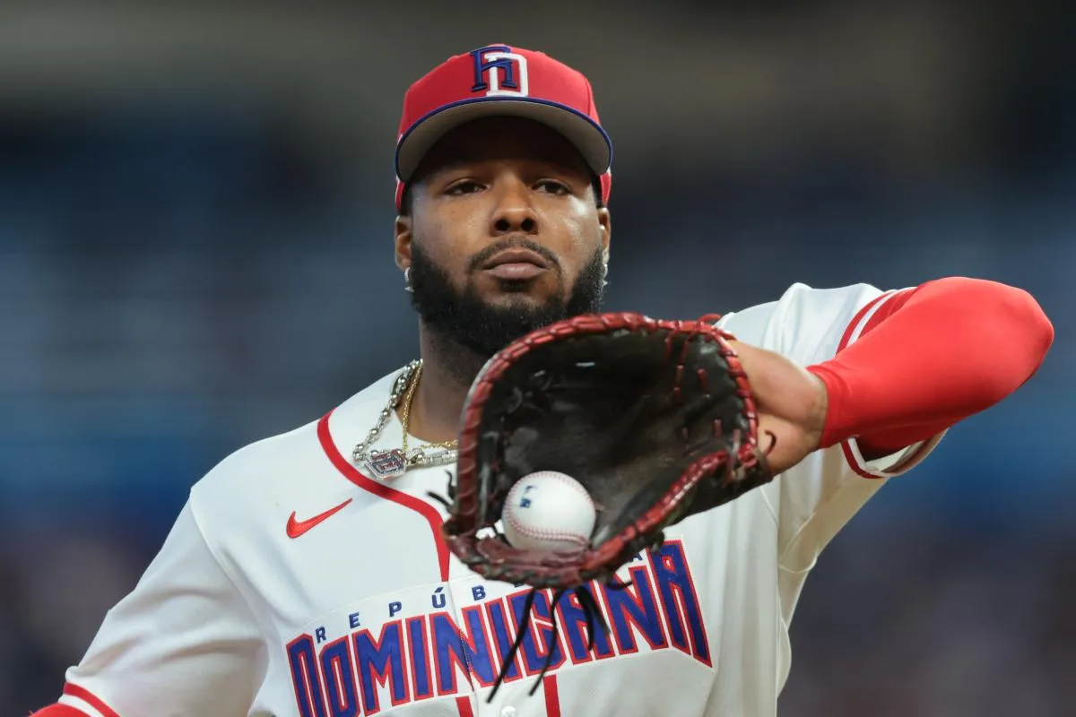 Dominican Republic first baseman Vladimir Guerrero Jr. (27) returns to the dugout against the Netherlands during the third inning at loanDepot Park.