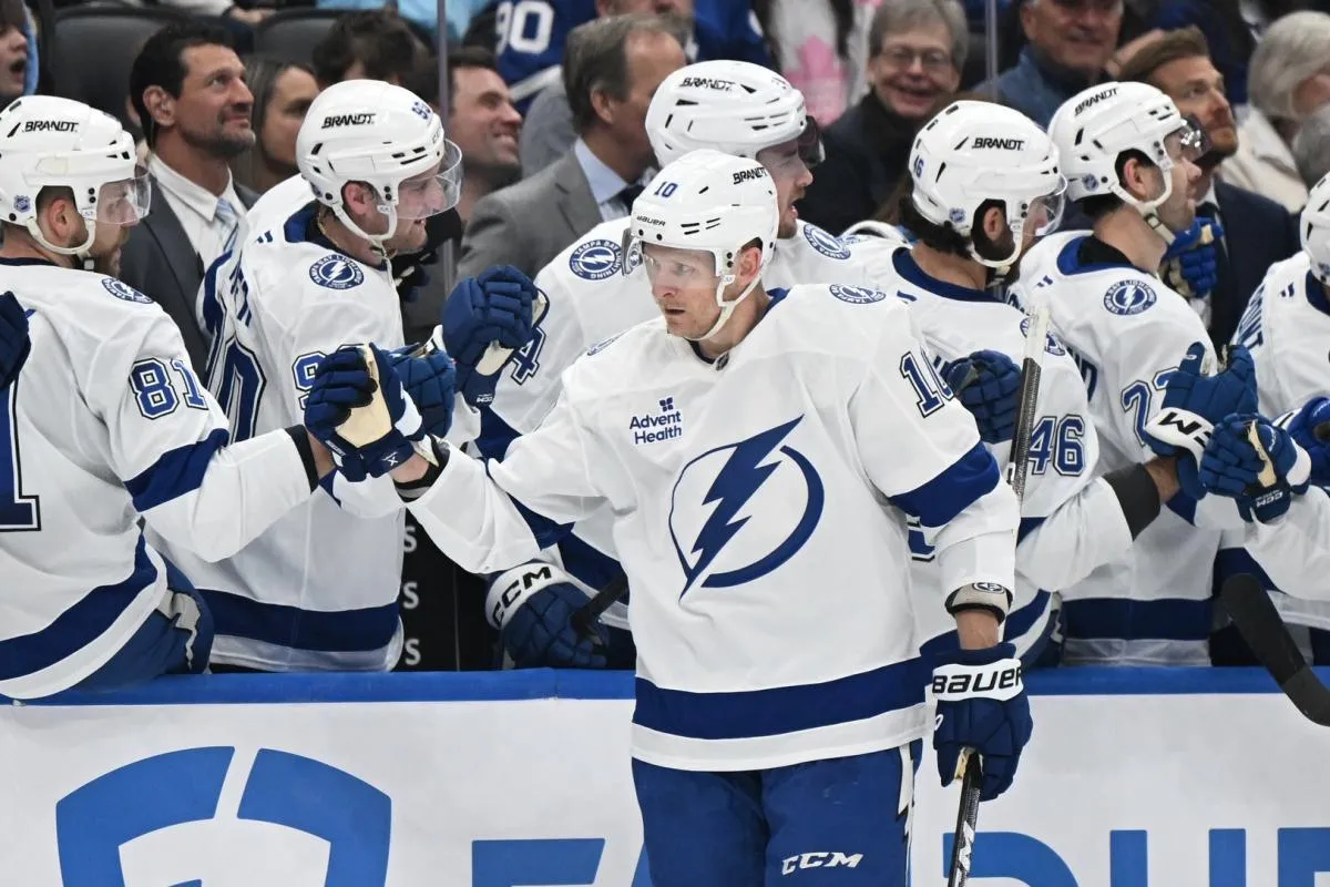 Tampa Bay Lightning forward Corey Perry (10) celebrates with teammates at the bench after scoring a goal against the Toronto Maple Leafs in the first period at Scotiabank Arena.