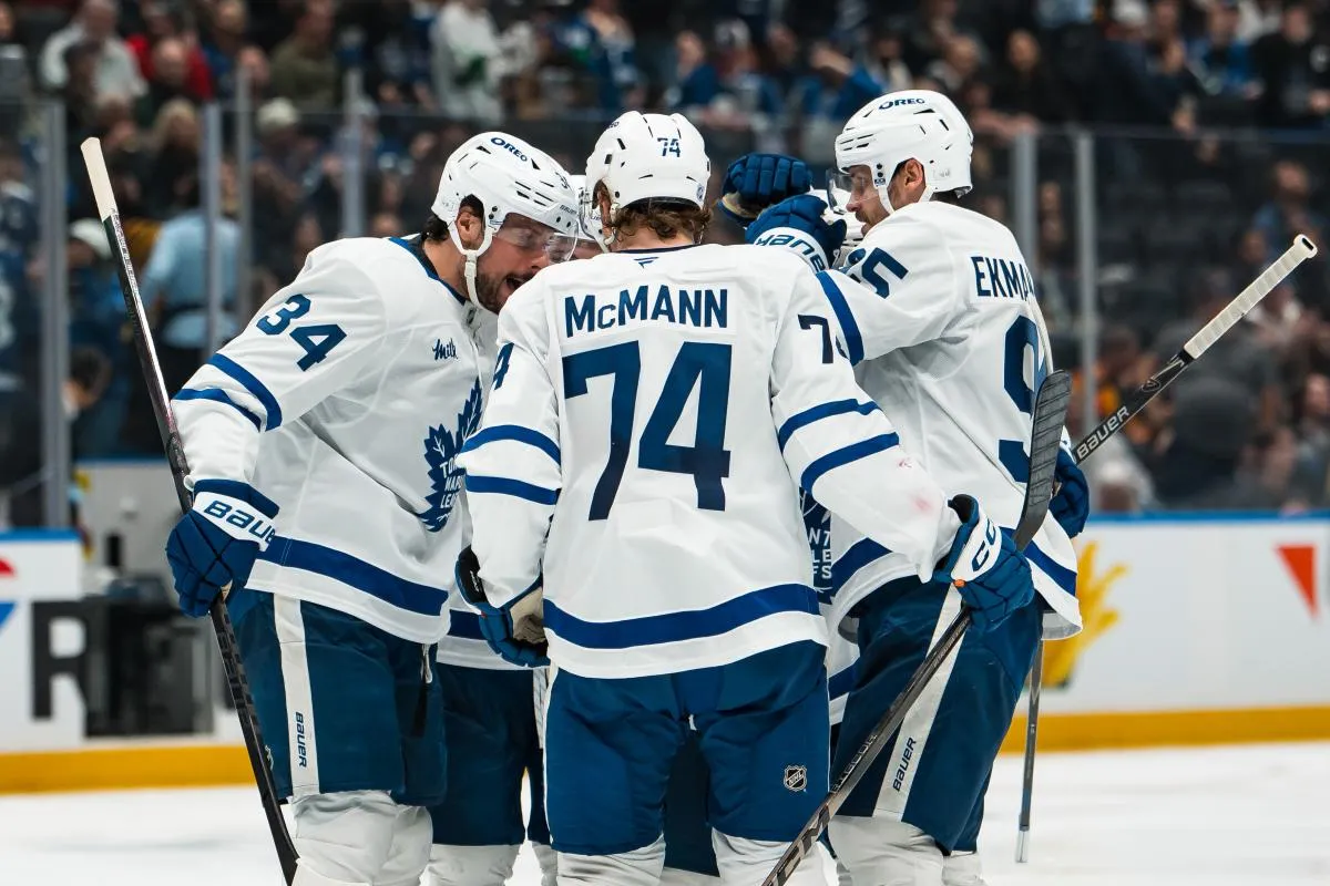 Toronto Maple Leafs forward Auston Matthews (34) and defenseman Troy Stecher (28) and forward Max Domi (11) and defenseman Oliver Ekman-Larsson (95) and forward Bobby McMann (74) celebrate Domi's goal against the Vancouver Canucks in the third period at Rogers Arena.