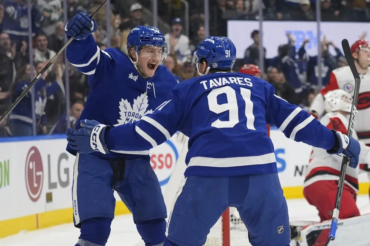 Toronto Maple Leafs forward Bobby McMann (74) reacts to a goal by forward John Tavares (91) against the Carolina Hurricanes during the first period at Scotiabank Arena.