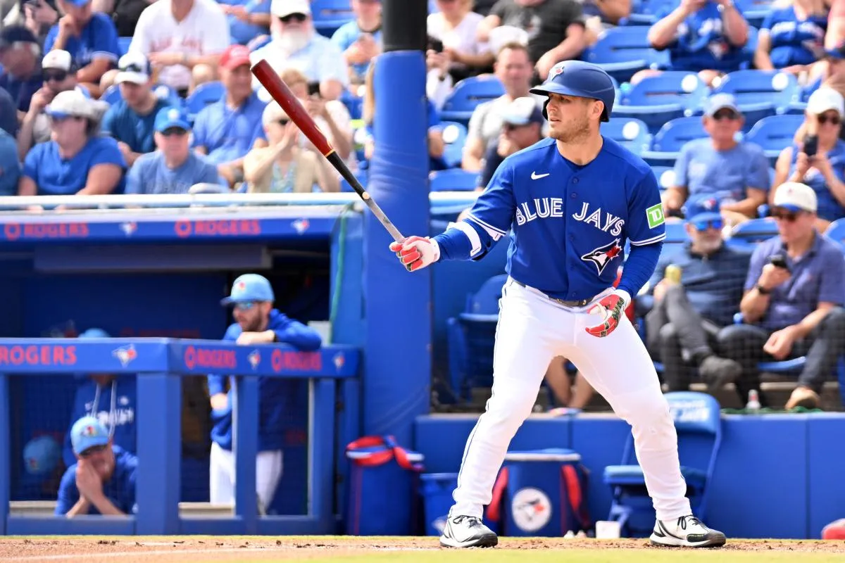 Toronto Blue Jays center fielder Daulton Varsho (5) bats in the first inning against the Florida Marlins during spring training at TD Ballpark.