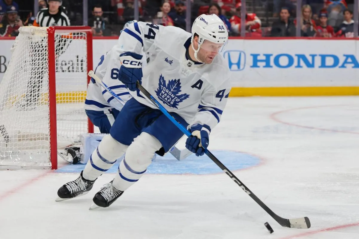 Toronto Maple Leafs defenseman Morgan Rielly (44) moves the puck against the Florida Panthers during the third period at Amerant Bank Arena.