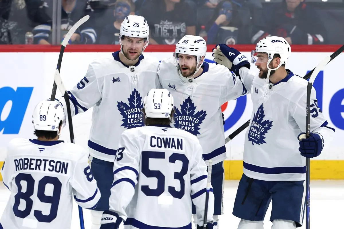 Toronto Maple Leafs defenseman Oliver Ekman-Larsson (95) celebrates a goal against the Winnipeg Jets in the third period at Canada Life Centre.