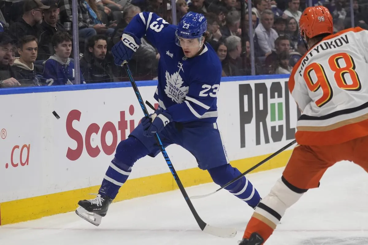 Toronto Maple Leafs forward Matthew Knies (23) tries to block a clearing attempt by Anaheim Ducks defenseman Pavel Mintyukov (98) during the first period at Scotiabank Arena.