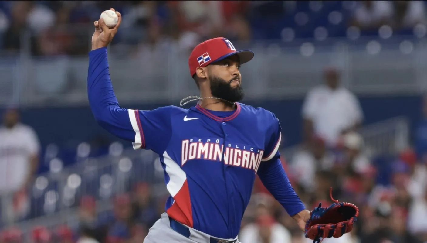 Dominican Republic relief pitcher Seranthony Dominguez (48) delivers a pitch against Israel during the ninth inning at loanDepot Park.