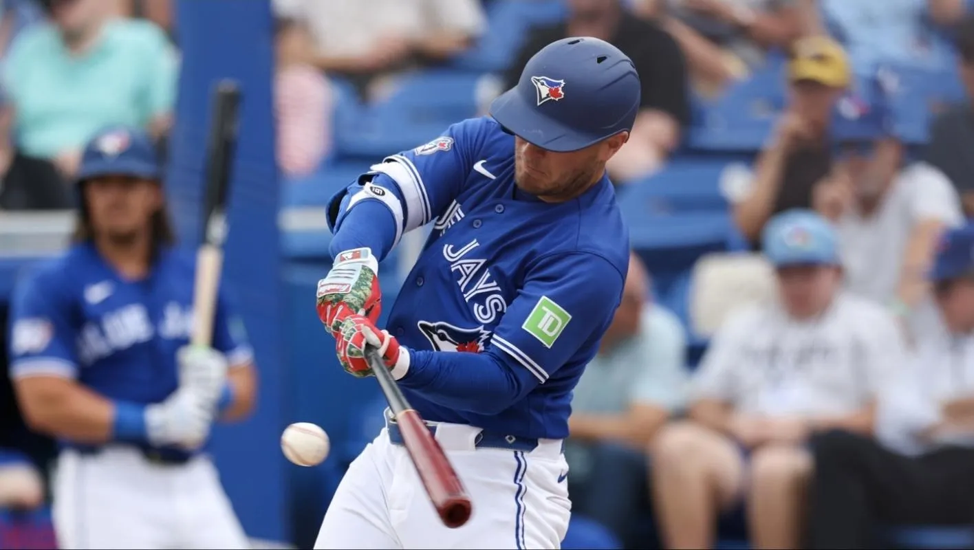 Toronto Blue Jays center fielder Daulton Varsho (5) hit a three run home run against the Minnesota Twins in the fifth inning during spring training at TD Ballpark.