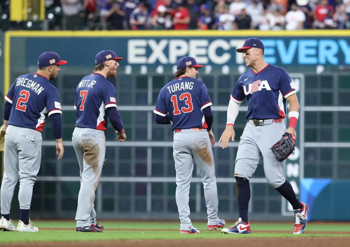 United States right fielder Aaron Judge (99), second baseman Brice Turang (13), shortstop Bobby Witt Jr. (7) and third baseman Alex Bregman (2) celebrate after defeating Canada during a quarterfinal game of the 2026 World Baseball Classic at Daikin Park.