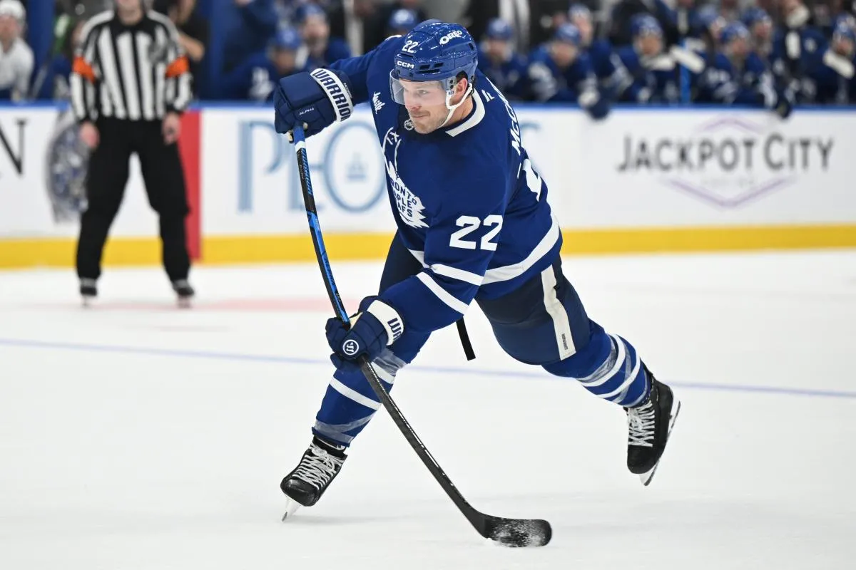 Toronto Maple Leafs defenseman Jake McCabe (22) hits a slapshot against the Tampa Bay Lightning in the third period at Scotiabank Arena.