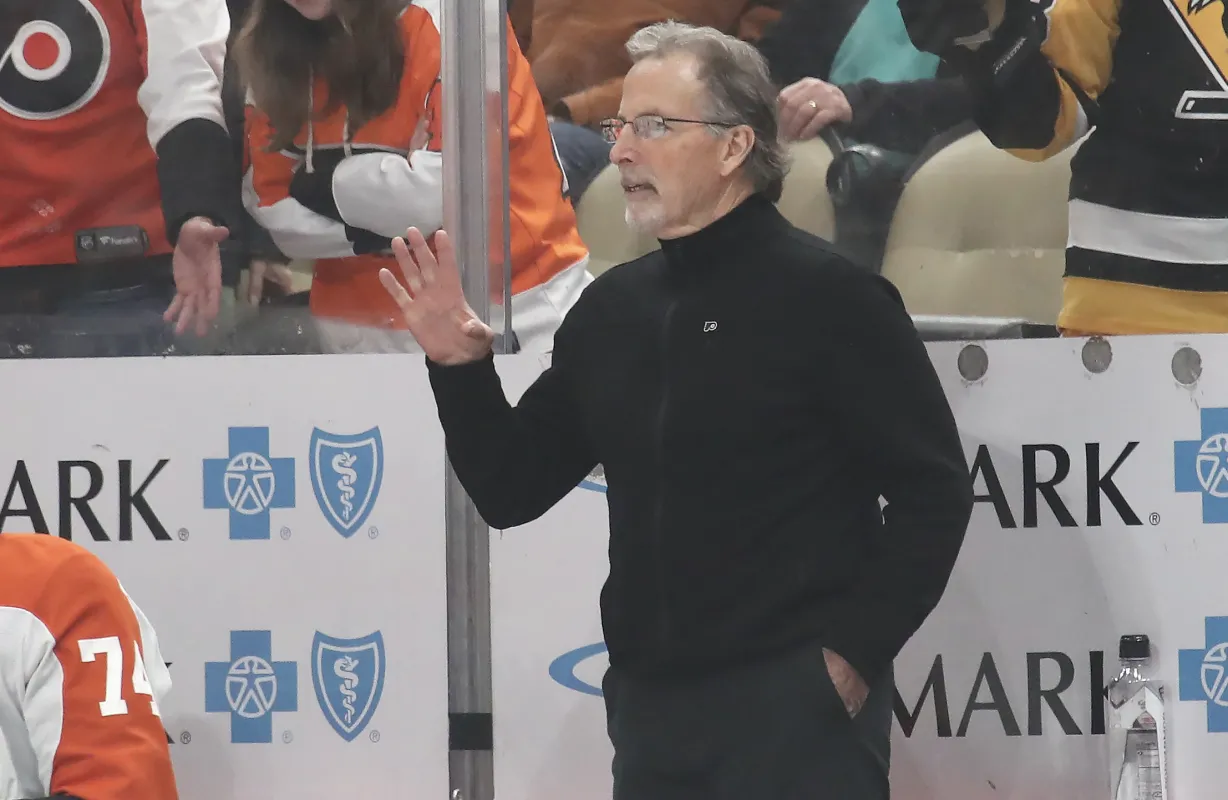 Philadelphia Flyers head coach John Tortorella reacts on the bench against the Pittsburgh Penguins during the second period at PPG Paints Arena.