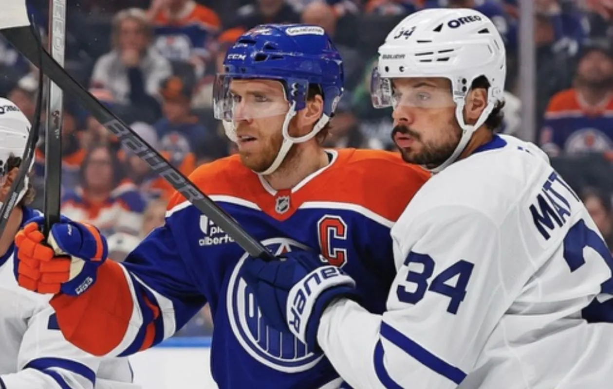 Edmonton Oilers forward Connor McDavid (97) and Toronto Maple Leafs forward Auston Matthews (34) battle for position during the first period at Rogers Place.