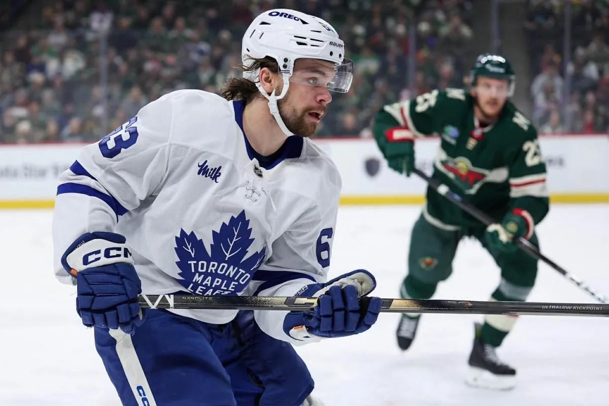 Toronto Maple Leafs forward Matias Maccelli skates for the puck against the Minnesota Wild at Grand Casino Arena.
