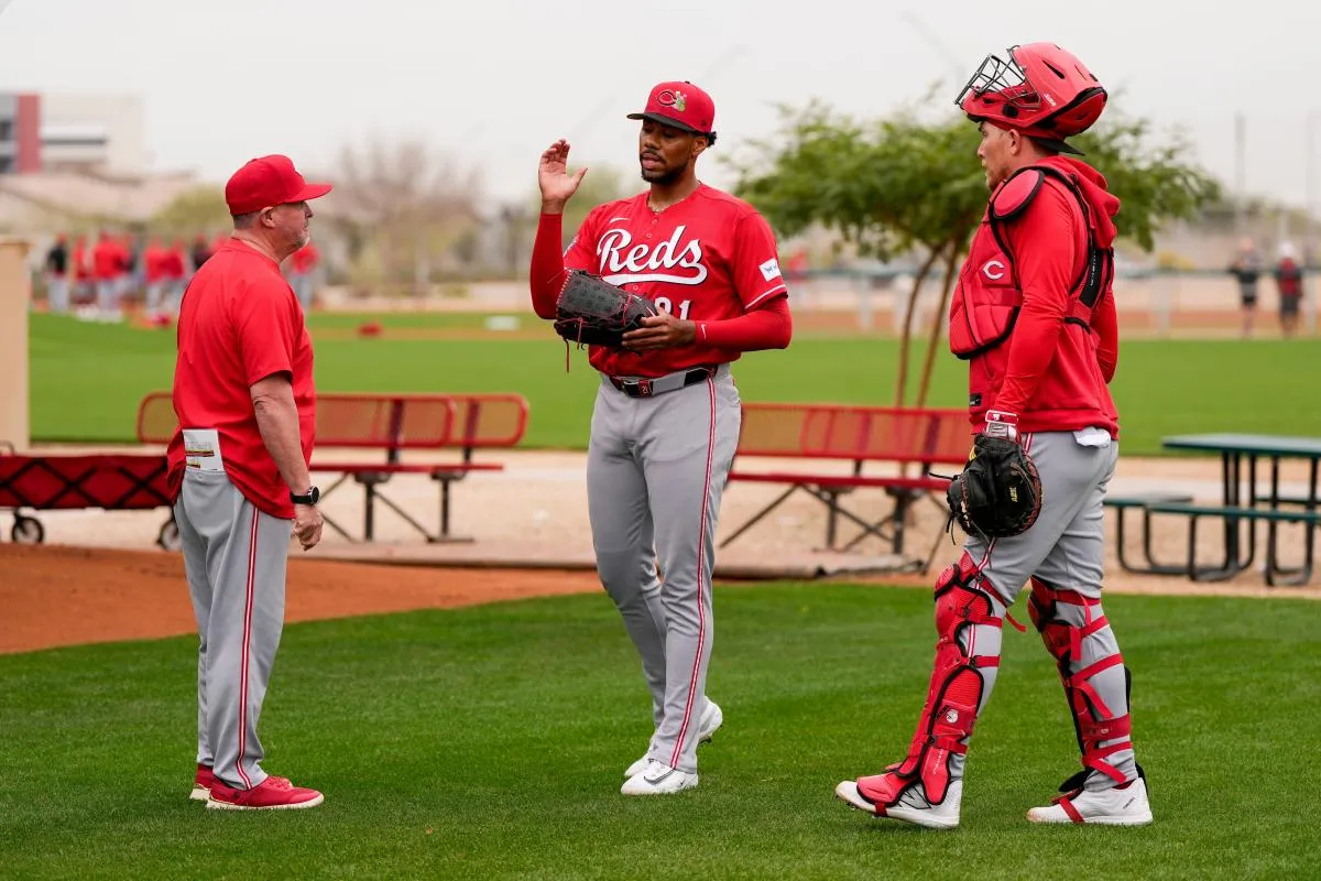 Cincinnati Reds pitching coach/director of pitching Derek Johnson (36) wraps up a bullpen session with pitcher Hunter Greene (21) at the Cincinnati Reds player development complex in Goodyear, Ariz., on Friday, Feb. 13, 2026.