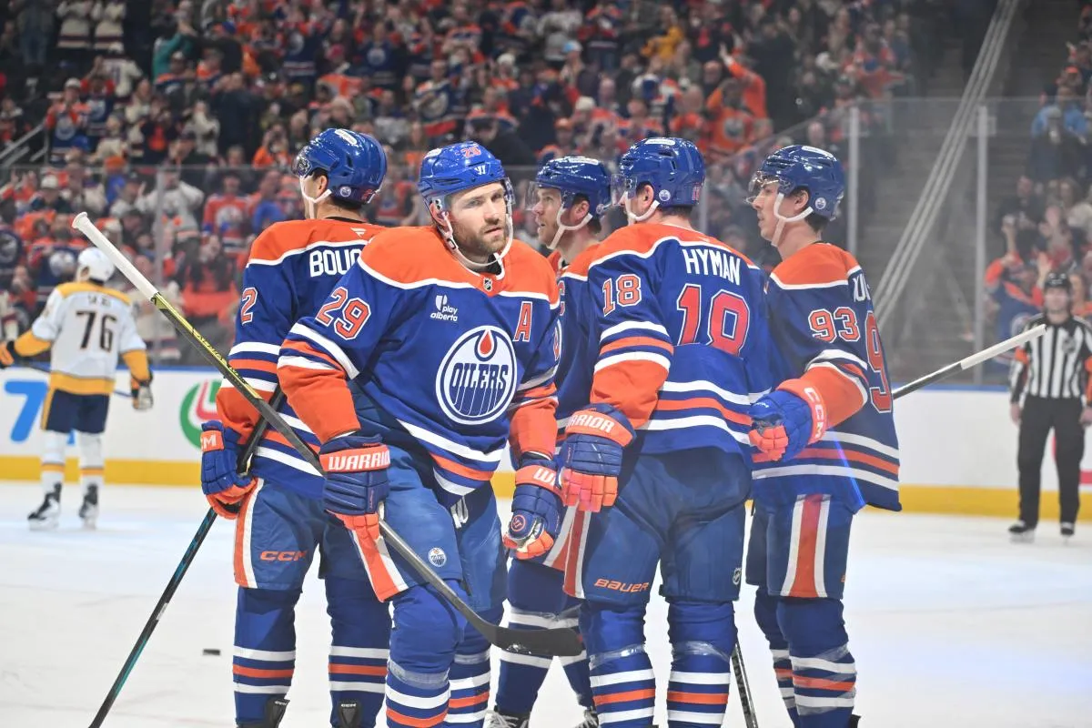 Edmonton Oilers center Leon Draisaitl (29), left wing Zach Hyman (18) and Oilers center Ryan Nugent-Hopkins (93) celebrate a goal on Nashville Predators goalie Justus Annunen (29) during the first period at Rogers Place.