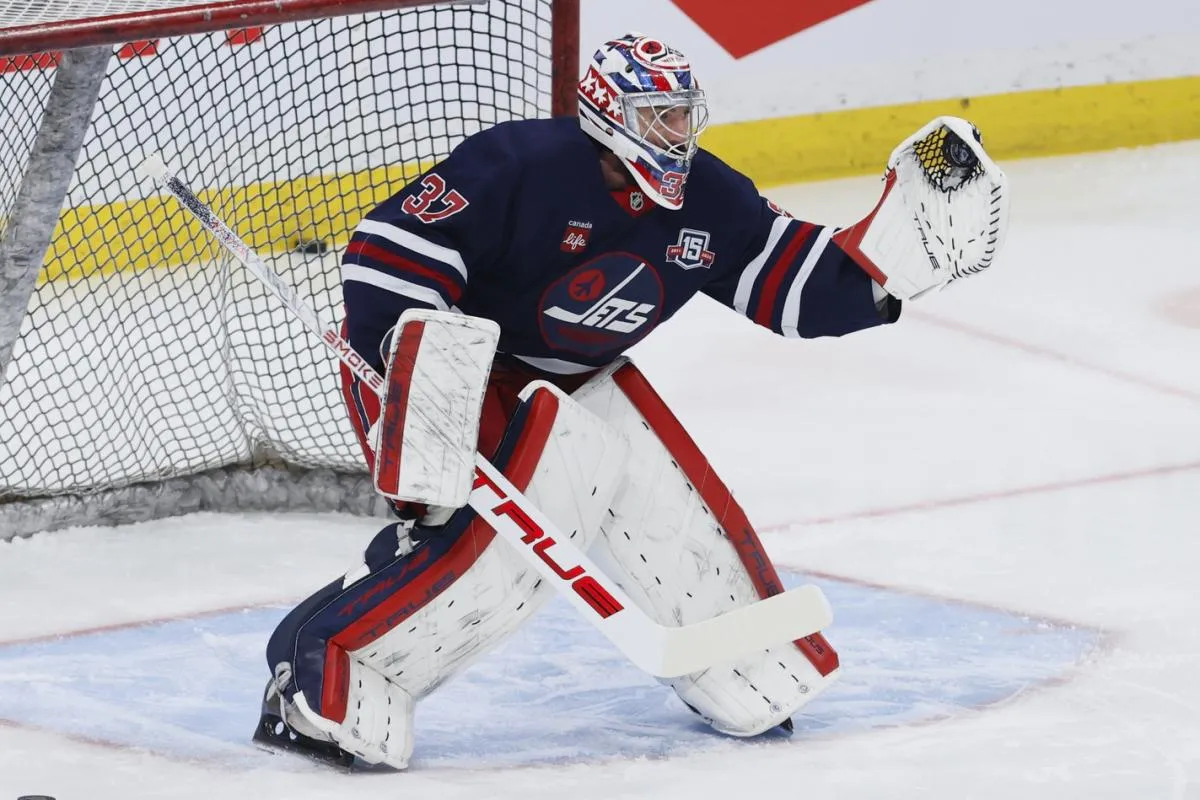 Winnipeg Jets goaltender Connor Hellebuyck (37) warms up before a game against the Colorado Avalanche at Canada Life Centre.