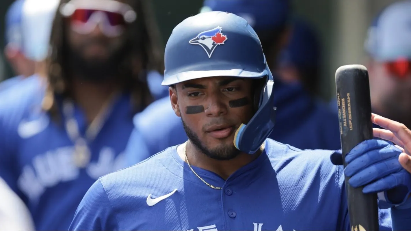 Toronto Blue Jays shortstop Leo Jimenez (49) celebrates after scoring against the St. Louis Cardinals during the second inning at Roger Dean Chevrolet Stadium.