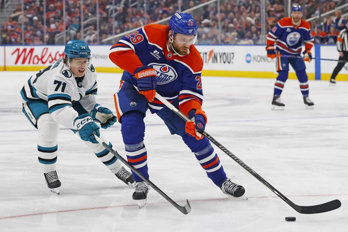 Edmonton Oilers forward Leon Draisaitl (29) protects the puck from San Jose Sharks forward Macklin Celebrini (71) during the third periodat Rogers Place.