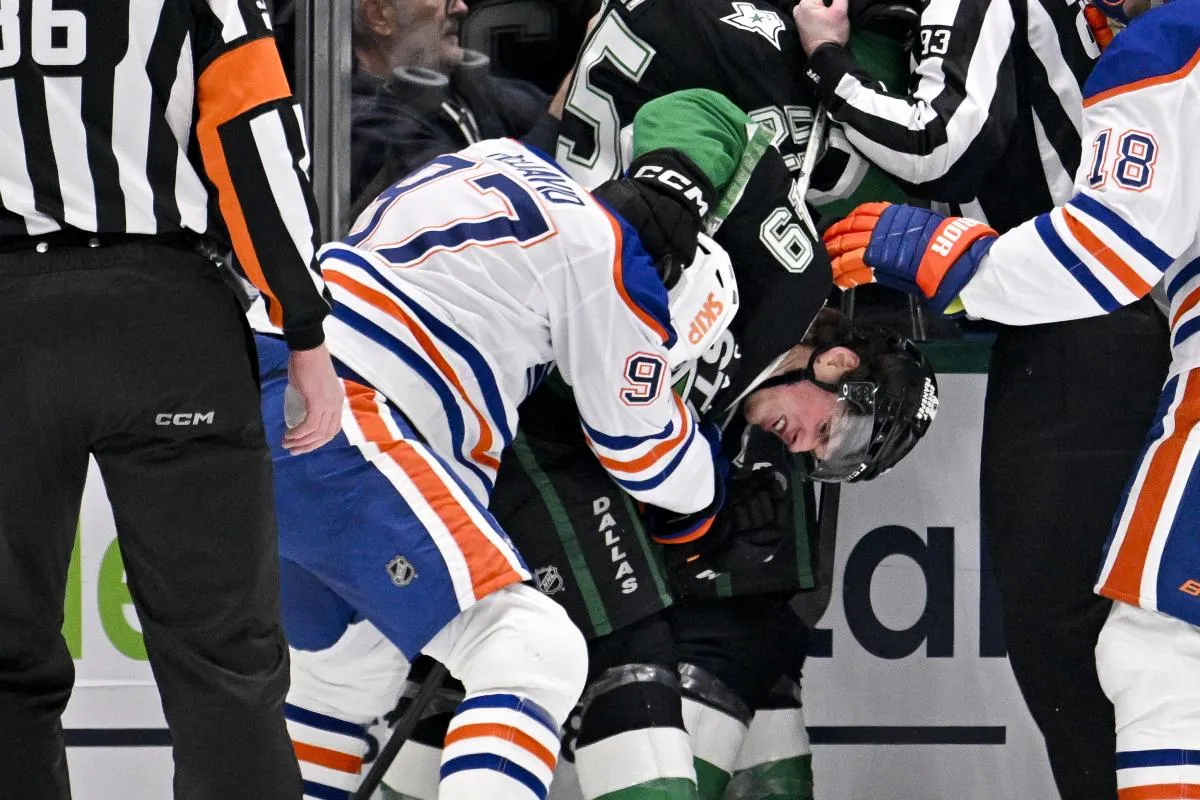 Edmonton Oilers center Connor McDavid (97) fights with Dallas Stars center Justin Hryckowian (49) during the second period at the American Airlines Center.