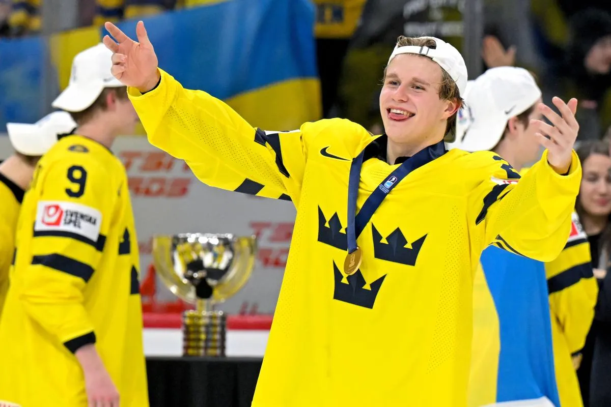Sweden defensemen Alfons Freij (20) celebrates a victory over Czechia after the final of the 2026 IIHF World Junior Championship ice hockey tournament at Grand Casino Arena.