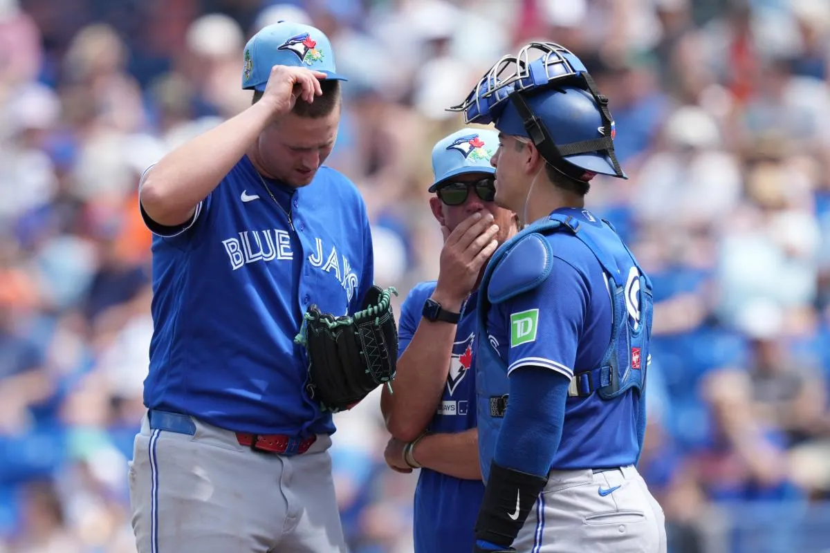 Toronto Blue Jays pitching coach Pete Walker (41) talks with pitcher Grant Rogers (69) and catcher Brandon Valenzuela (59) in the second inning against the New York Mets at Clover Park