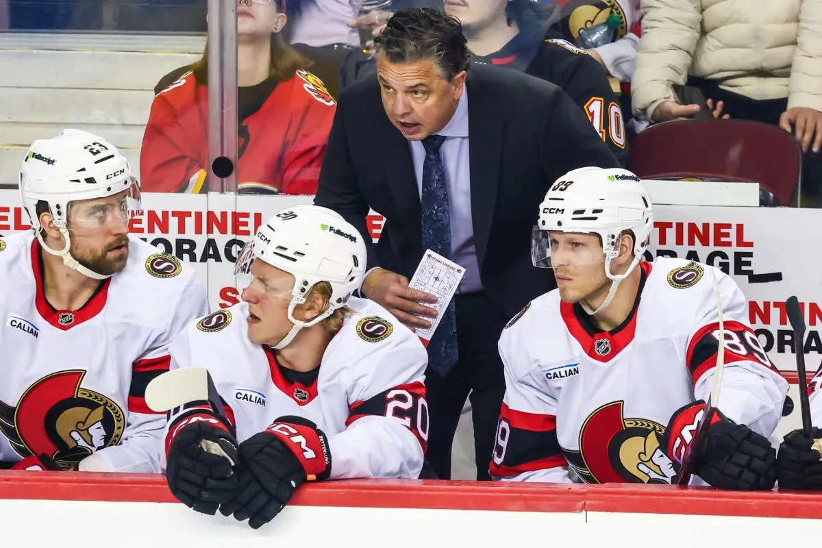 Ottawa Senators head coach Travis Green on his bench during the first period against the Calgary Flames at Scotiabank Saddledome.