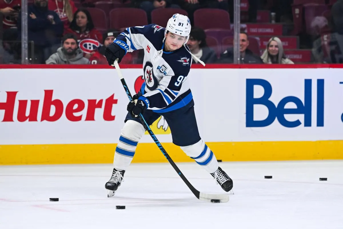 Winnipeg Jets center Cole Perfetti (91) shoots during warm-ups before a game against the Montreal Canadiens at Bell Centre.