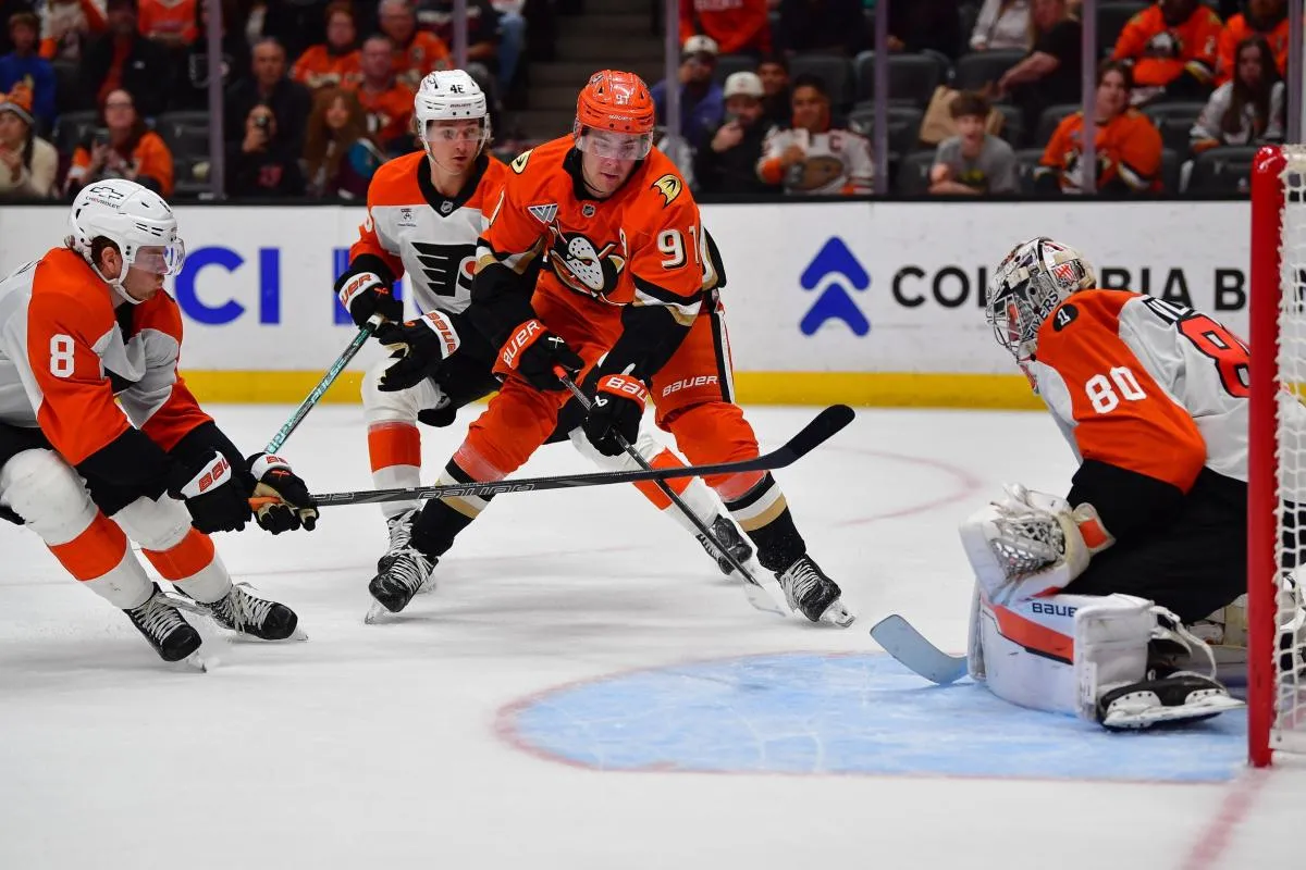 Anaheim Ducks center Leo Carlsson (91) moves in for a shot as Philadelphia Flyers defenseman Cam York (8) and center Trevor Zegras (46) help goaltender Dan Vladar (80) defend the goal during the overtime period at Honda Center.