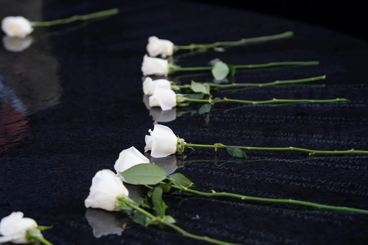 Guests lay flowers during a wreath laying ceremony at the Southern Poverty Law Center Civil Rights Memorial in Montgomery, Ala. on Thursday, March 5, 2026.