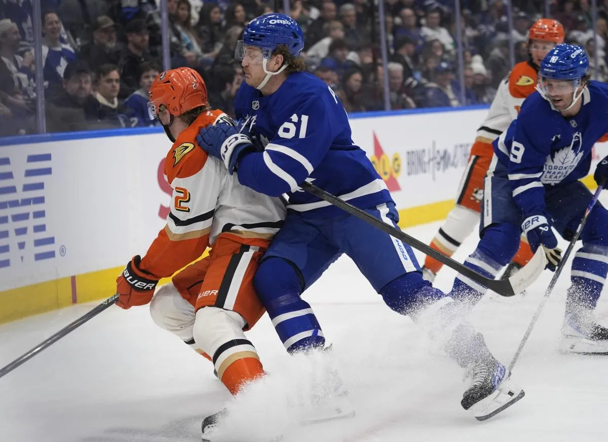 Toronto Maple Leafs forward Michael Pezzetta (61) checks Anaheim Ducks defenseman Jackson LaCombe (2) during the third period at Scotiabank Arena.