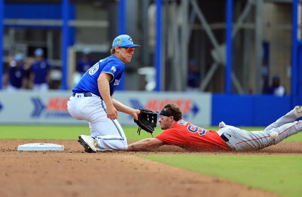 Boston Red Sox center fielder Braiden Ward (92) slides safe into second base as he steals and Toronto Blue Jays shortstop Josh Kasevich (86) attempted to tag him out during the third inning at TD Ballpark.