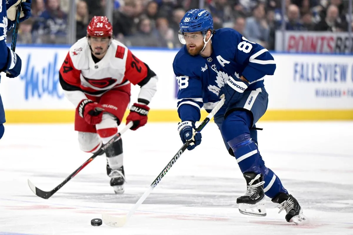 Toronto Maple Leafs forward William Nylander (88) skates with the puck as Carolina Hurricanes forward Seth Jarvis (24) pursues him in the first period at Scotiabank Arena.