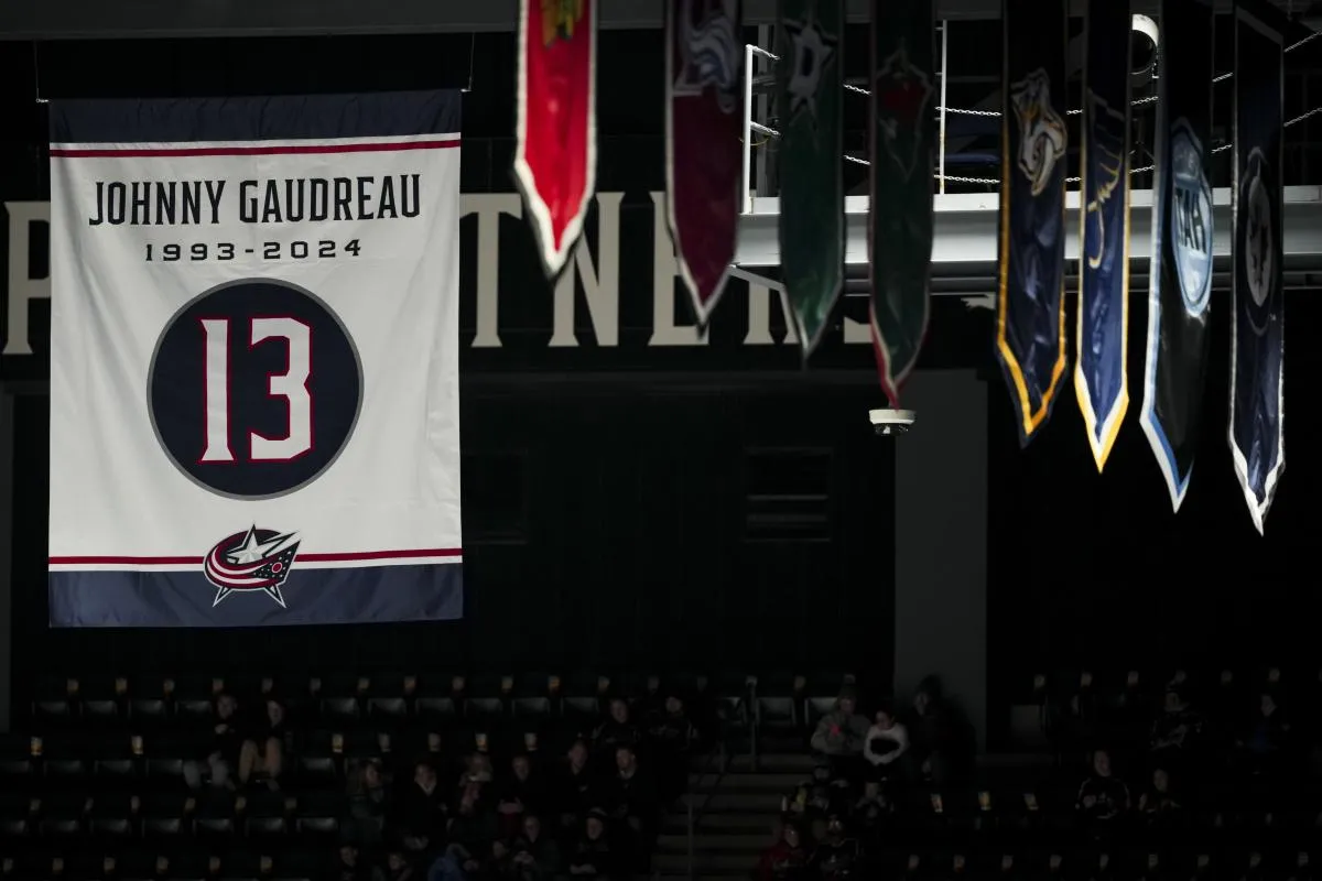 A banner honoring the late Johnny Gaudreau is seen in the rafters before the game between the Calgary Flames and the Columbus Blue Jackets at Nationwide Arena.