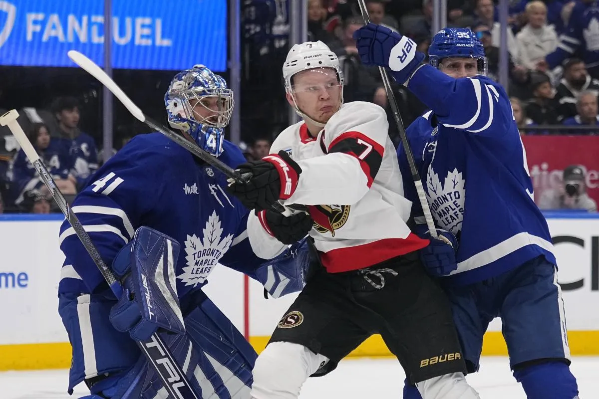 Ottawa Senators forward Brady Tkachuk (7) and Toronto Maple Leafs defenceman Oliver Ekman-Larsson (95) battle for position in front of goaltender Anthony Stolarz (41) during the second period of game one of the first round of the 2025 Stanley Cup Playoffs at Scotiabank Arena.
