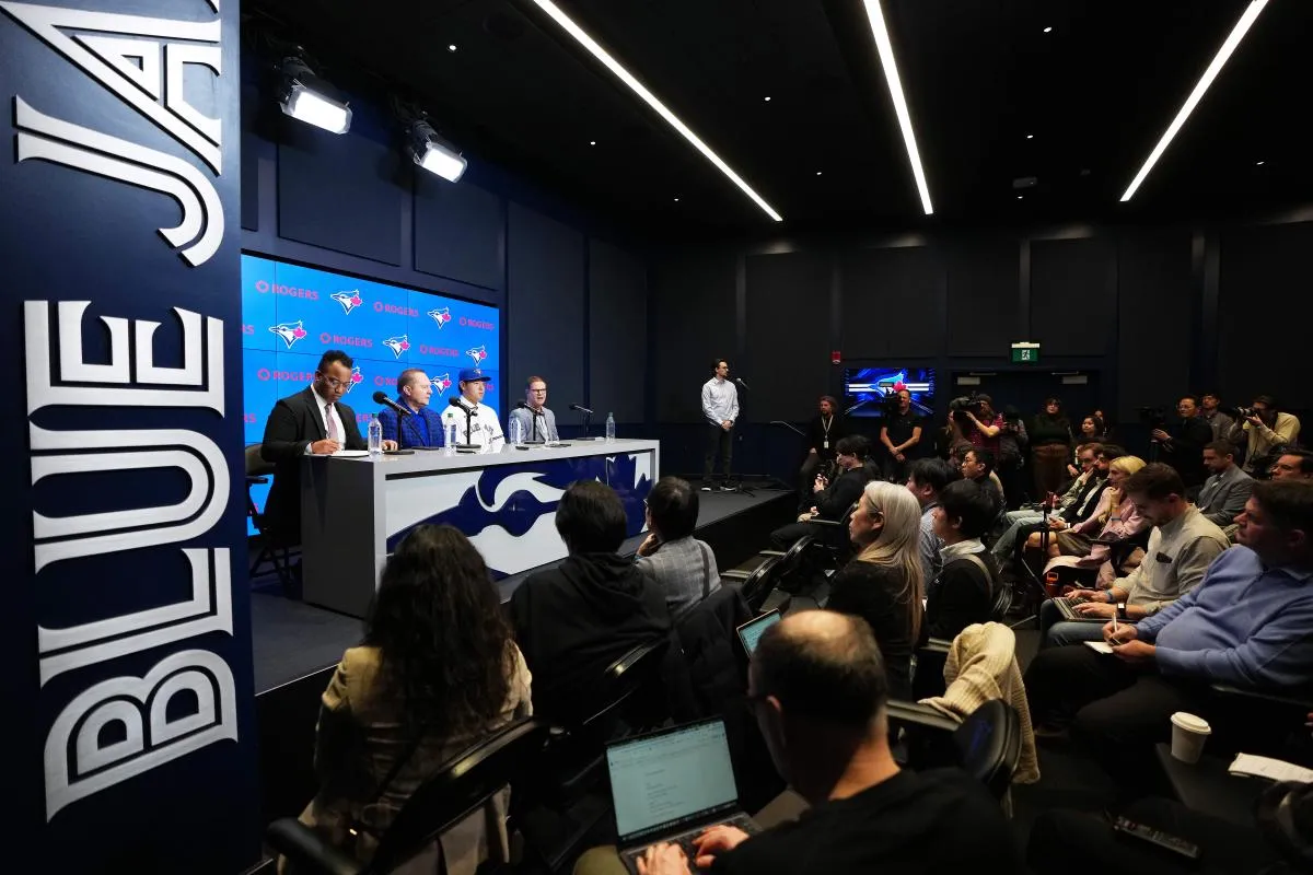 Toronto Blue Jays general manager Ross Atkins speaks to the media with Kazuma Okamoto during the press conference at Rogers Centre.