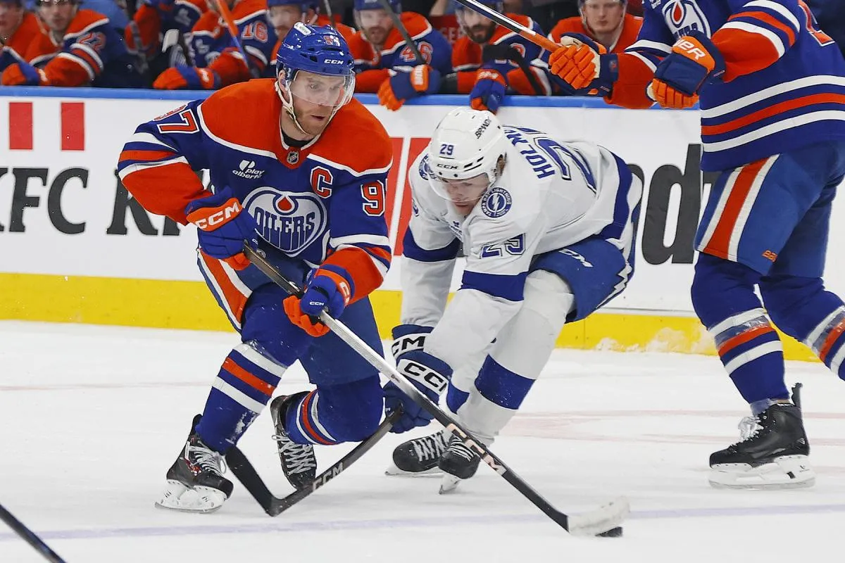 Edmonton Oilers forward Connor McDavid (97) carries the puck past Tampa Bay Lightning forward Pontus Holmberg (29) during the third period at Rogers Place.