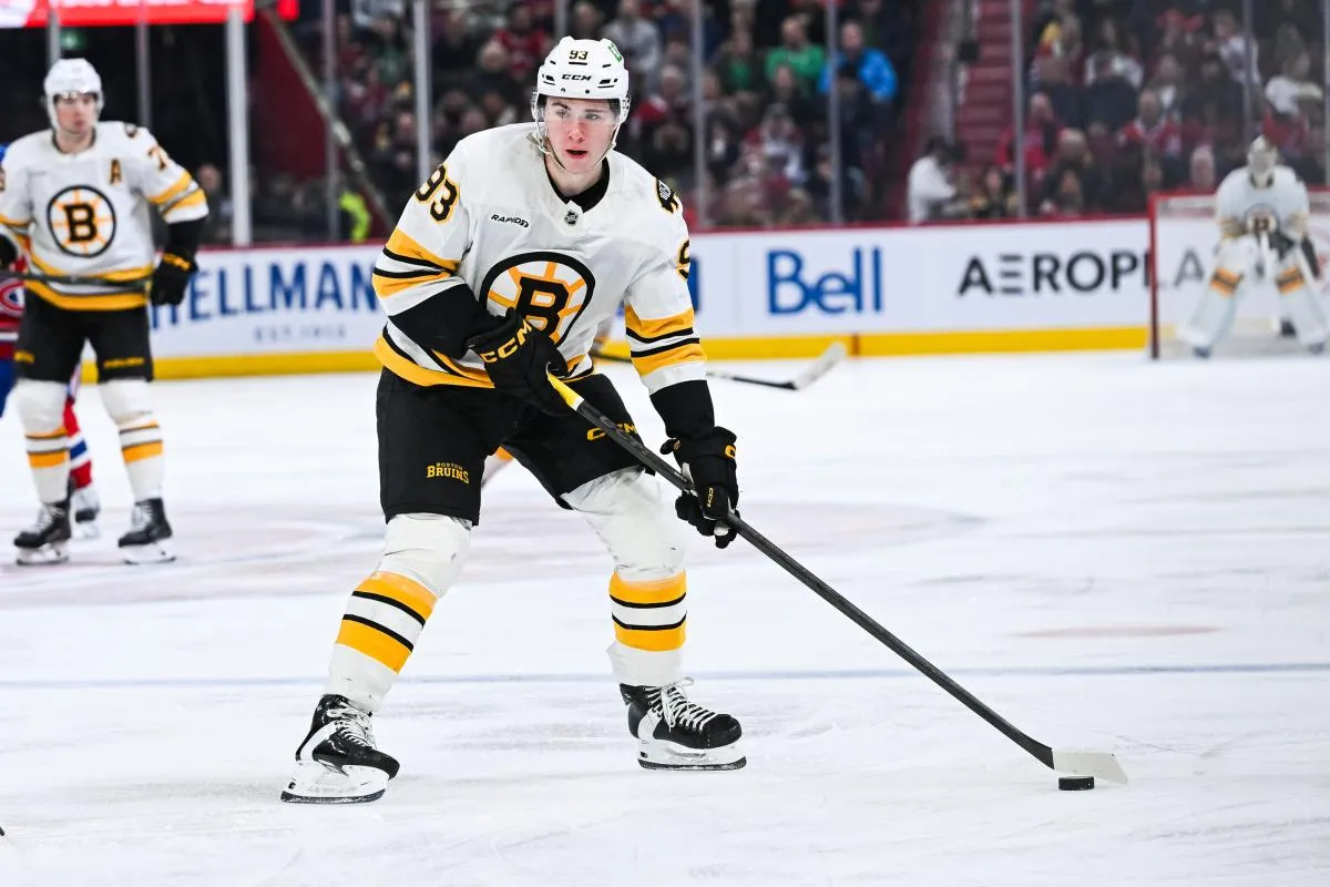 Boston Bruins center Fraser Minten (93) plays the puck against the Montreal Canadiens during the third period at Bell Centre.