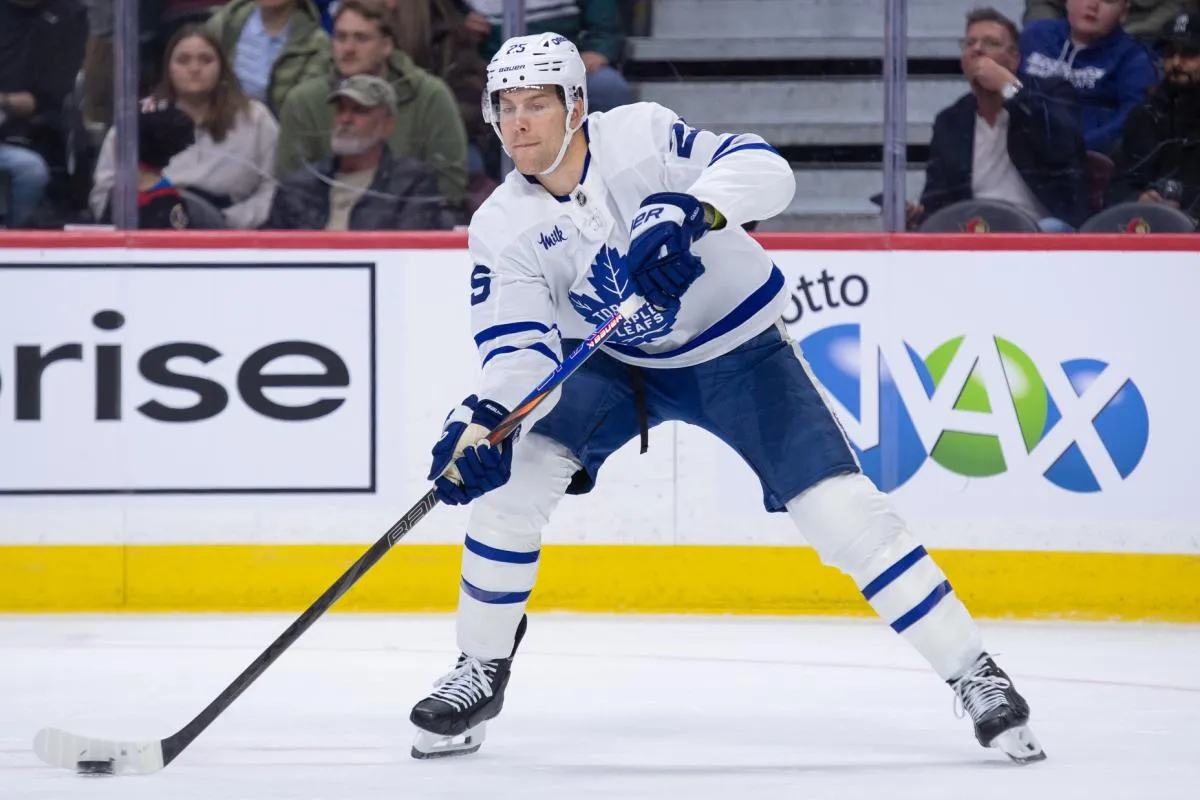 Toronto Maple Leafs defenseman Brandon Carlo (25) shoots the puck in the first period against the Ottawa Senators at the Canadian Tire Centre.