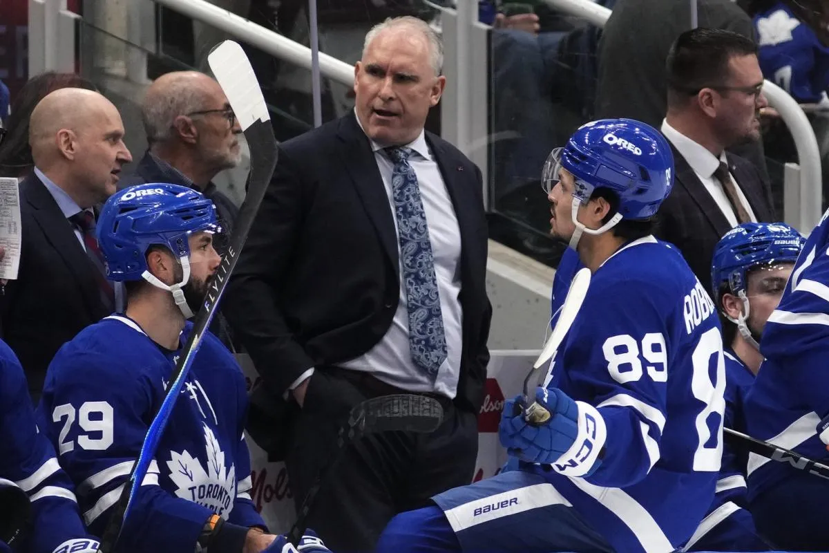 Toronto Maple Leafs head coach Craig Berube talks forward Benoit-Olivier Groulx (29) and forward Nic Robertson (89) during a break in the action against the Anaheim Ducks during the third period at Scotiabank Arena.