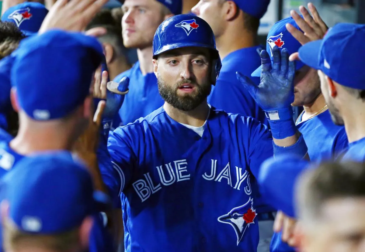 Toronto Blue Jays center fielder Kevin Pillar (11) is congratulated after hitting home run against the Kansas City Royals in the eighth inning at Kauffman Stadium.