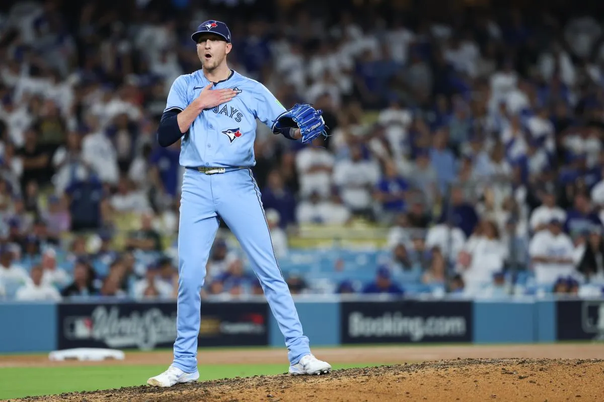Toronto Blue Jays pitcher Jeff Hoffman (23) celebrates after a strikeout to end the game against the Los Angeles Dodgers during game five of the 2025 MLB World Series at Dodger Stadium.