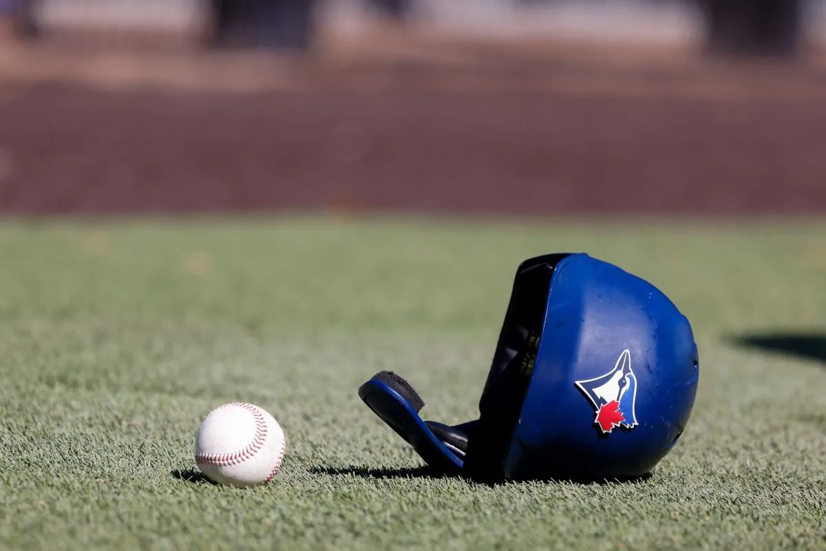 Toronto Blue Jays batting helmet lays on the ground during workouts at Toronto Blue Jays Player Development Complex.