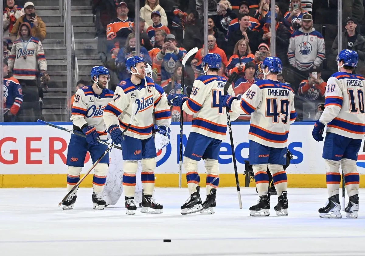 Edmonton Oilers center Adam Henrique (19), center Connor McDavid (97), left winger Matt Jones (46), and goalie Connor Ingram (39) celebrate their win over the Calgary Flames during the third period at Rogers Place.