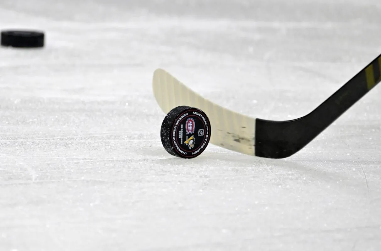A puck with the Pittsburgh Penguins and Montreal Canadiens logo during the warmup at the Bell Centre.