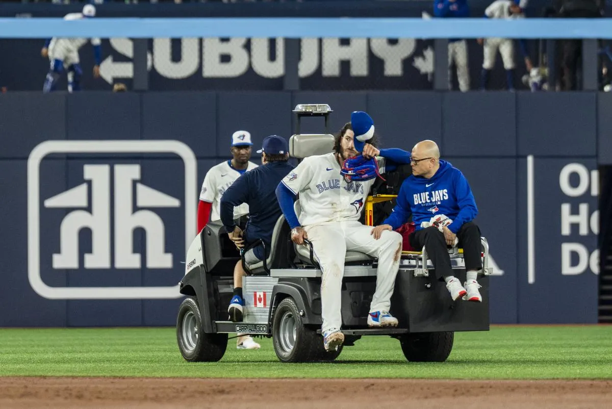 Toronto Blue Jays Cody Ponce (66) tips his cap to the fans upon leaving the game after being injured on a play at first base against the Colorado Rockies during the third inning at Rogers Centre.