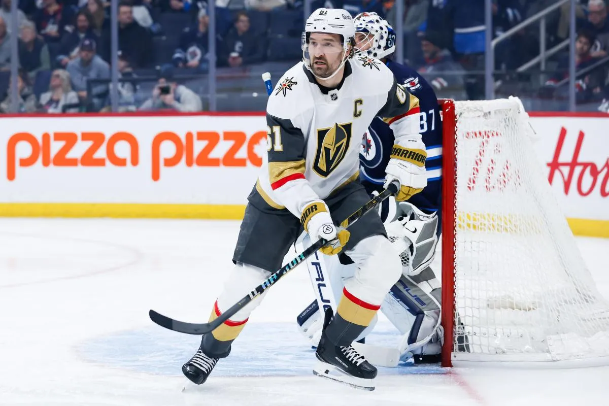 Vegas Golden Knights forward Mark Stone (61) and Winnipeg Jets goalie Connor Hellebuyck (37) look for the puck during the first period at Canada Life Centre.