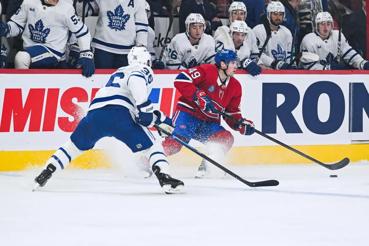 Montreal Canadiens center Jared Davidson (49) plays the puck against Toronto Maple Leafs defenseman Ben Danford (38) during the first period at Bell Centre.
