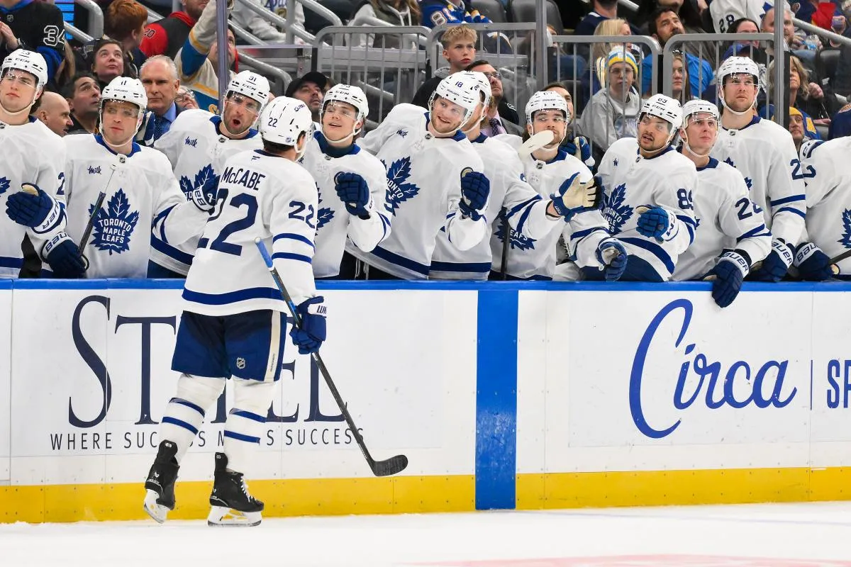 Toronto Maple Leafs defenseman Jake McCabe (22) is congratulated by teammates after scoring against the St. Louis Blues during the third period at Enterprise Center.