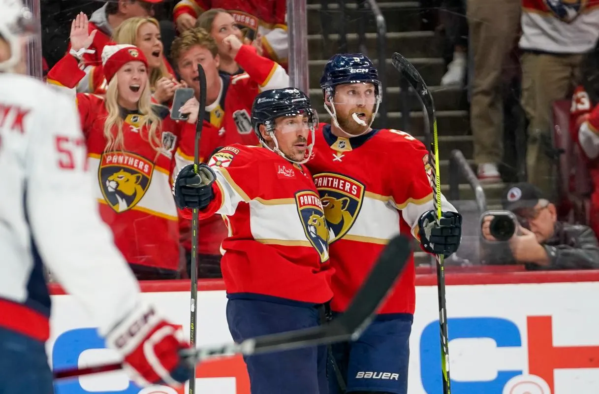 Florida Panthers left wing Brad Marchand (63) and center Sam Bennett (9) celebrate his goal against the Washington Capitals during the third period at Amerant Bank Arena.