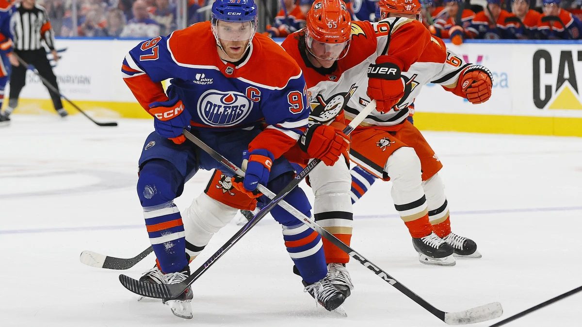 Edmonton, Alberta, CAN;Anaheim Ducks defensemen Jacob Trouba (65) tries to tie up the stick of Edmonton Oilers forward Connor McDavid (97) during the third period in game two of the first round of the 2026 Stanley Cup Playoffs at Rogers Place.
