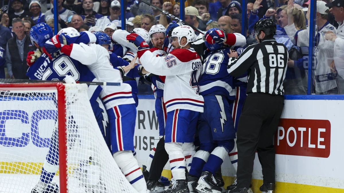 the Tampa Bay Lightning fight with the Montreal Canadiens in the first period during game two of the first round of the 2026 Stanley Cup Playoffs at Benchmark International Arena.