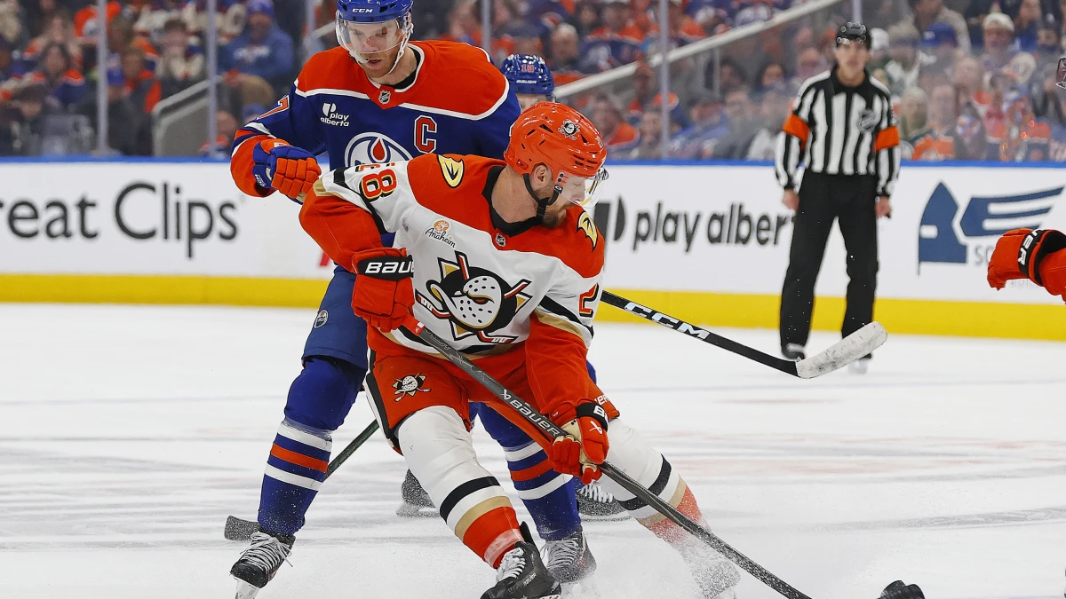 Edmonton, Alberta, CAN;Anaheim Ducks forward Jeff Viel (28) knocks the puck away from Edmonton Oilers forward Connor McDavid (97) during the third period in game two of the first round of the 2026 Stanley Cup Playoffs at Rogers Place.